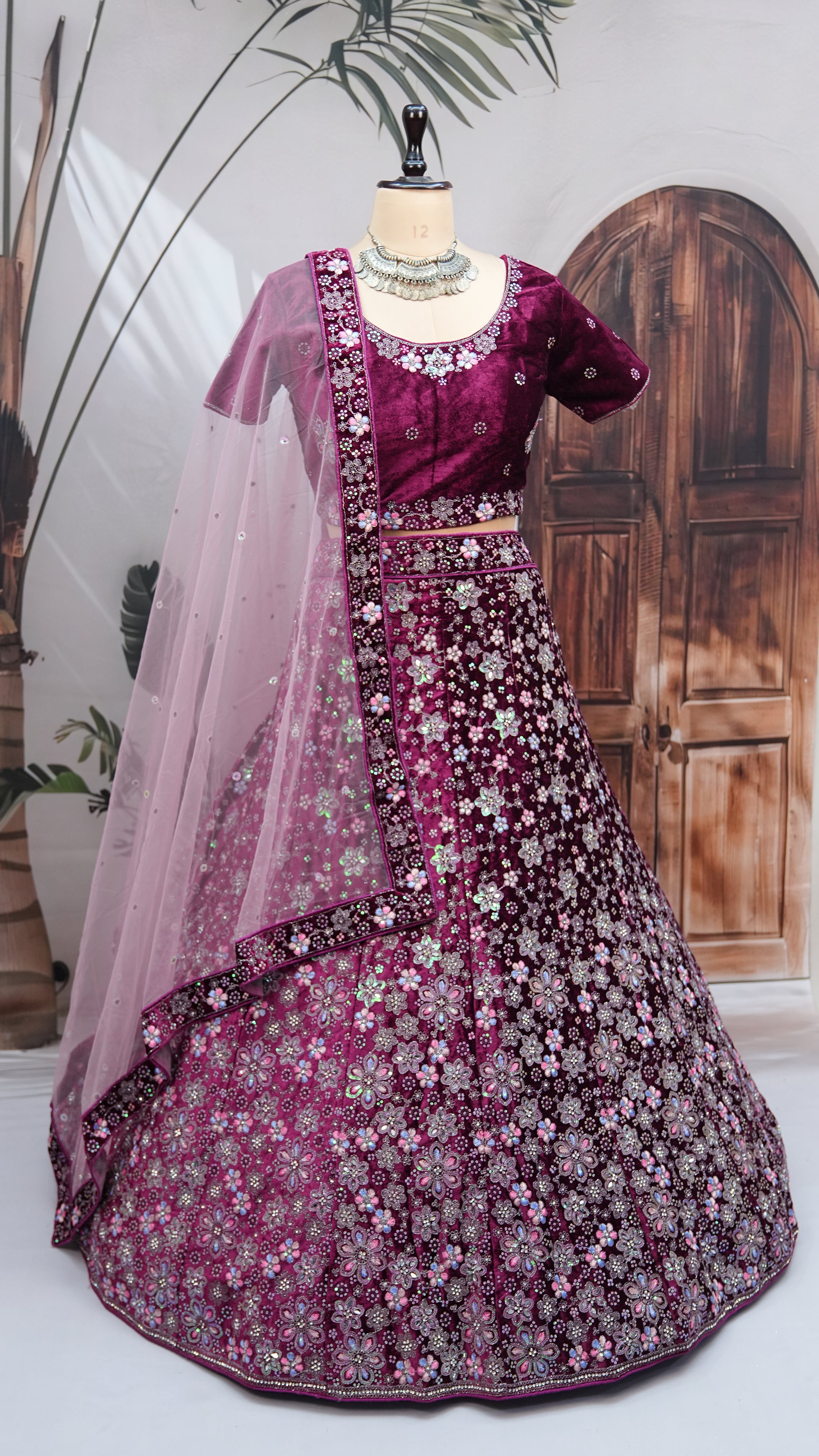 Teal wine Velvet Lehenga Choli with Floral Embroidery & Net Dupatta