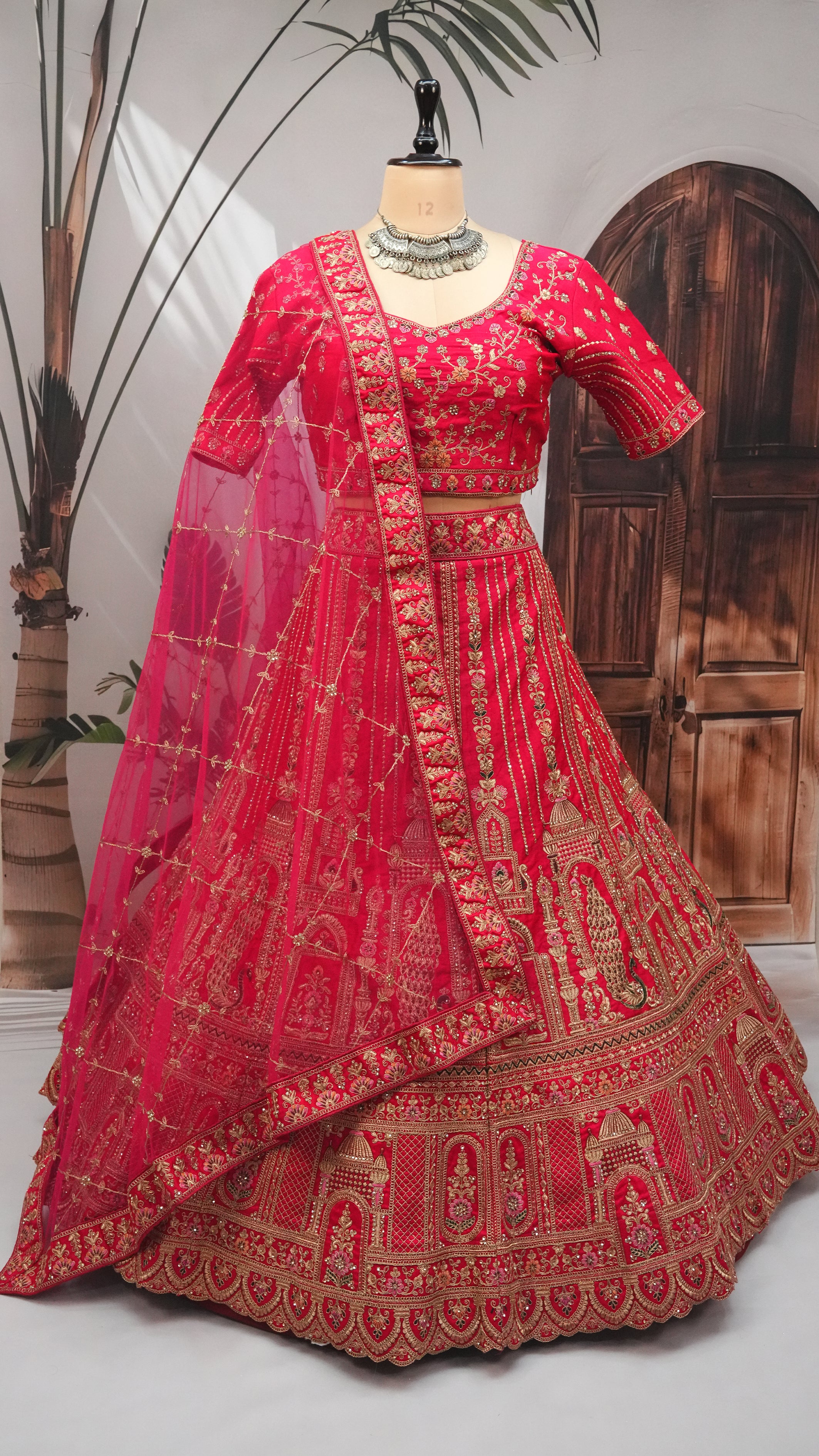 Rani Bridal Lehenga Choli with Heavy Gold Embroidery & Net Dupatta