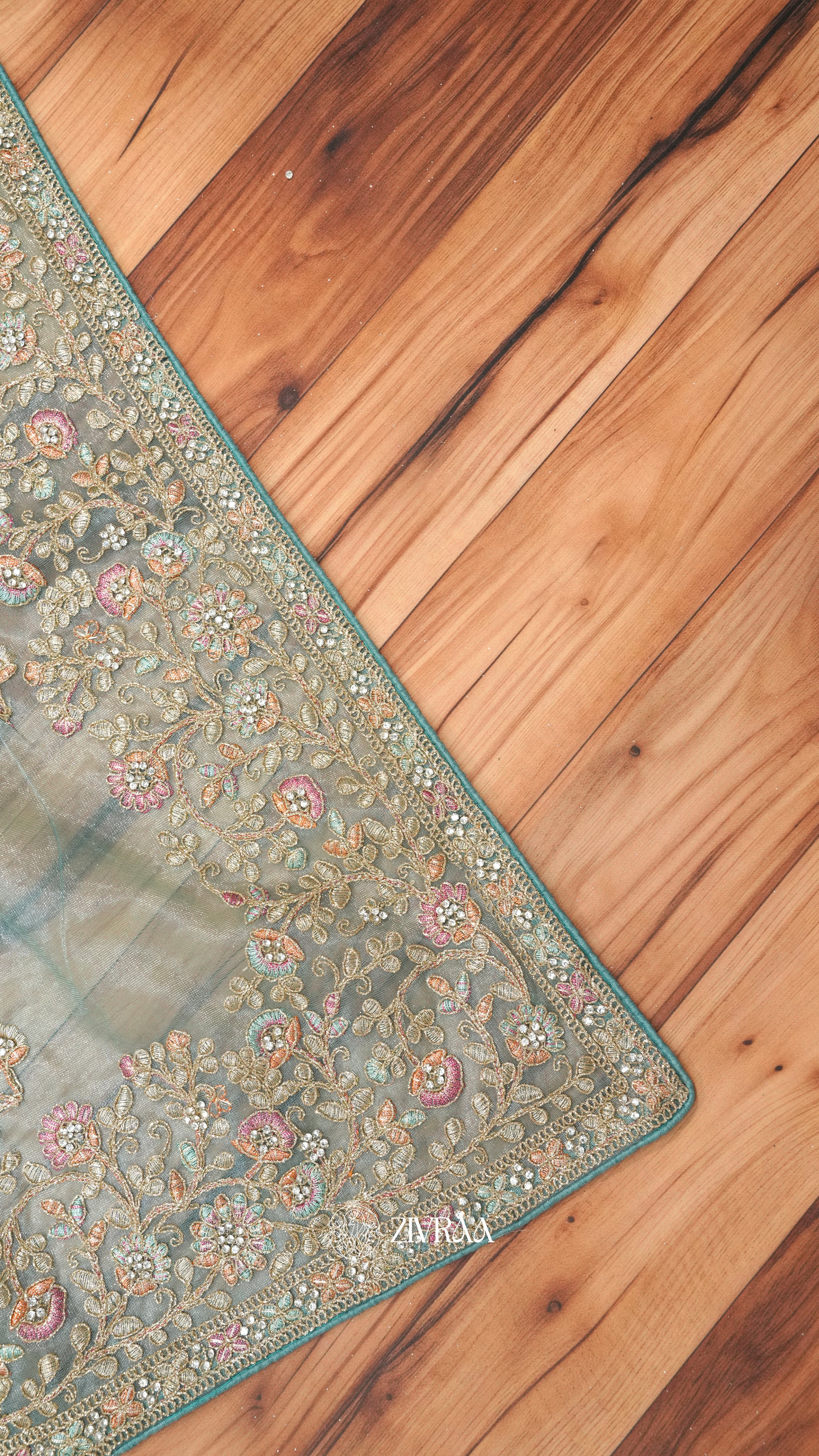 Elegant Teal Green Embroidered Shimmer Net Saree with Floral Zari & Stone Work