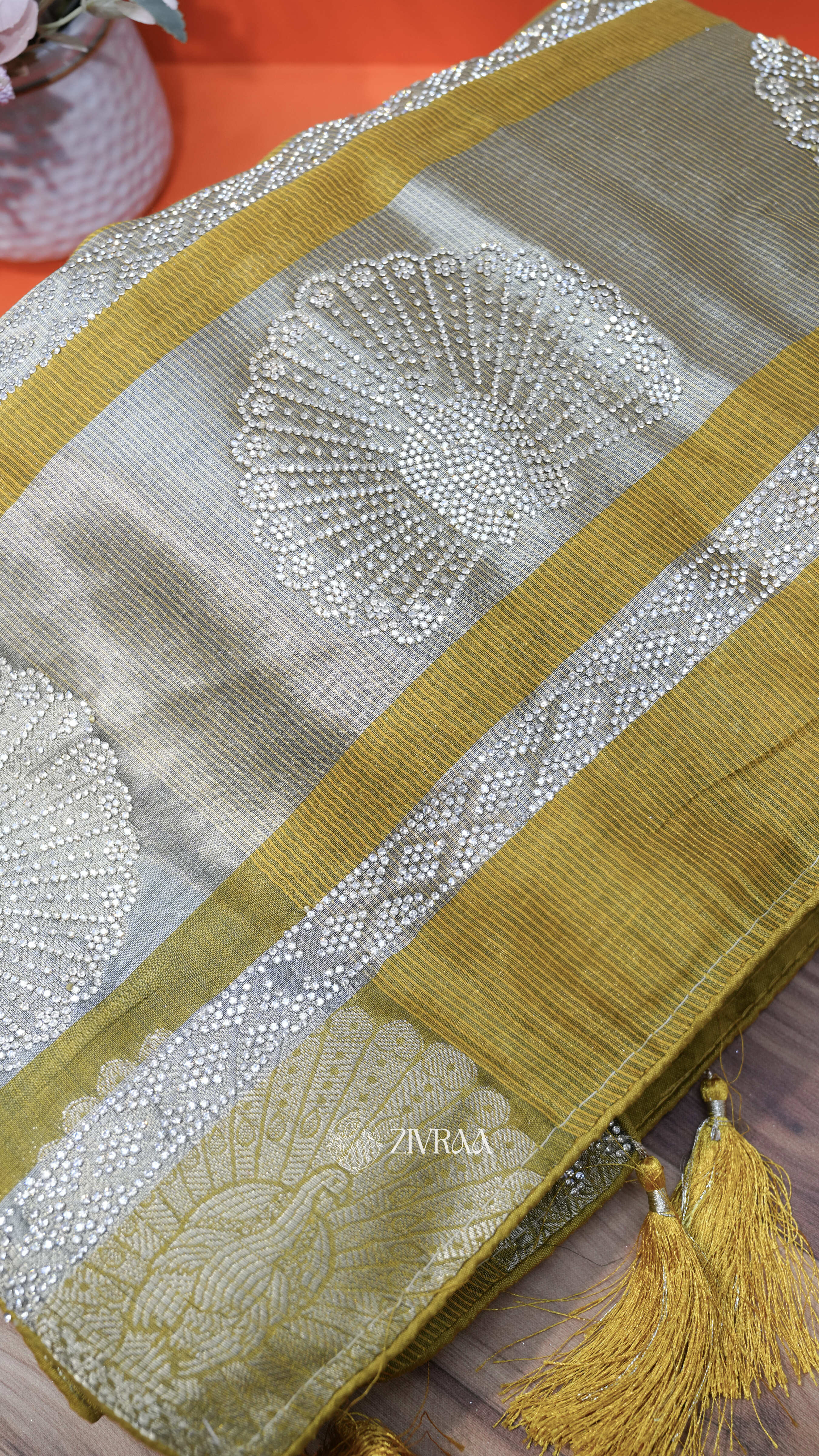 Mustard machine woven Saree with Silver Motifs & Tassel Pallu
