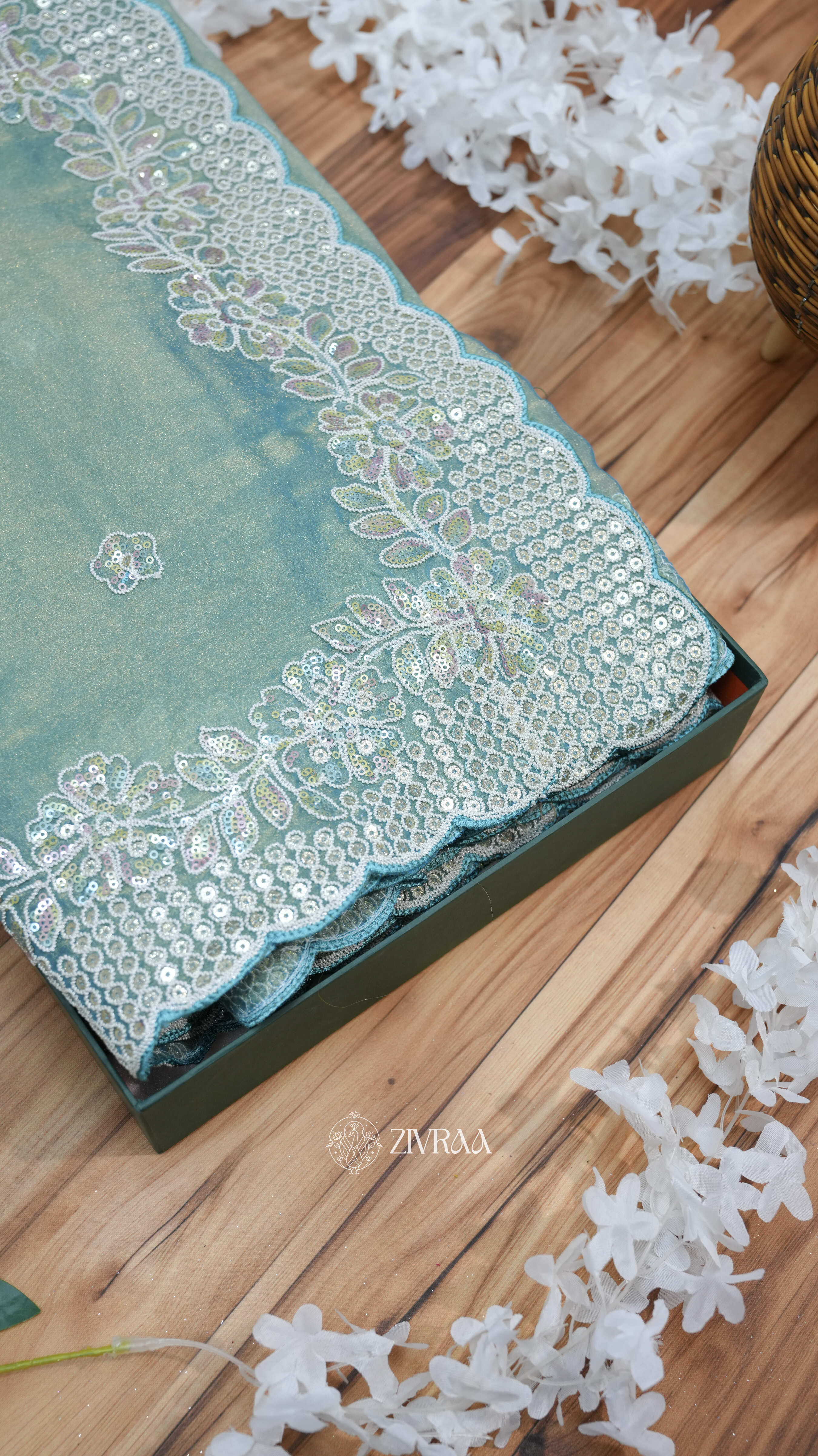 elegant sea green saree with a sequin and thread embroidery