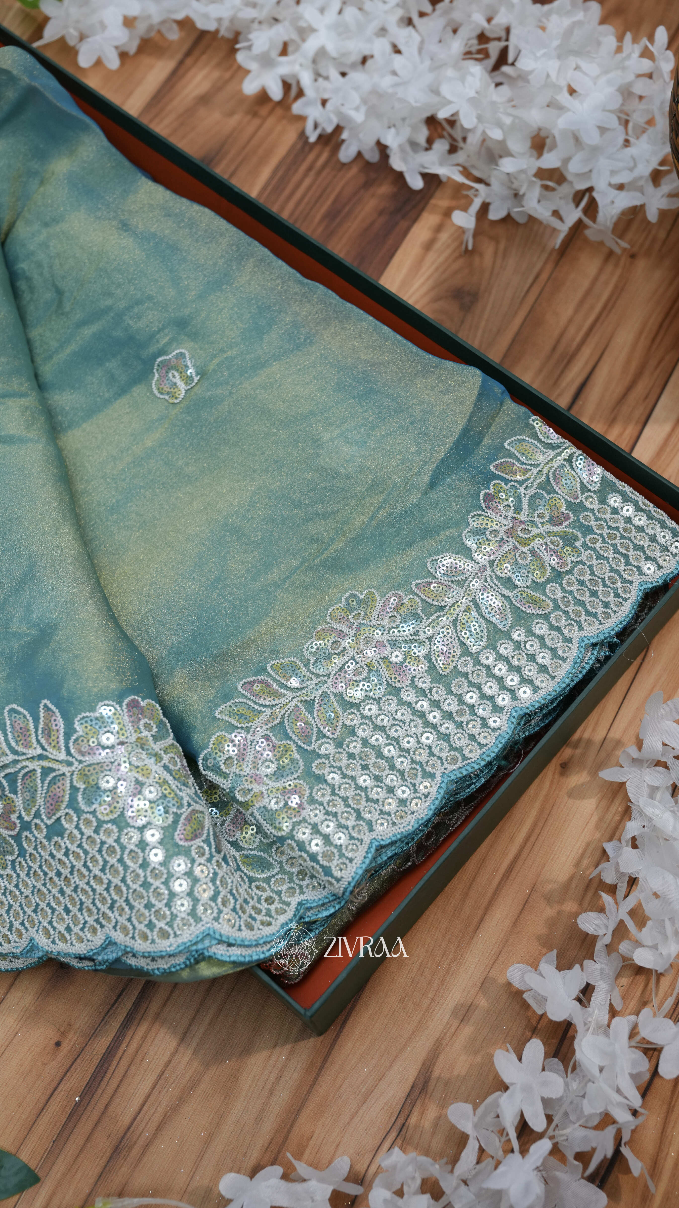 elegant sea green saree with a sequin and thread embroidery