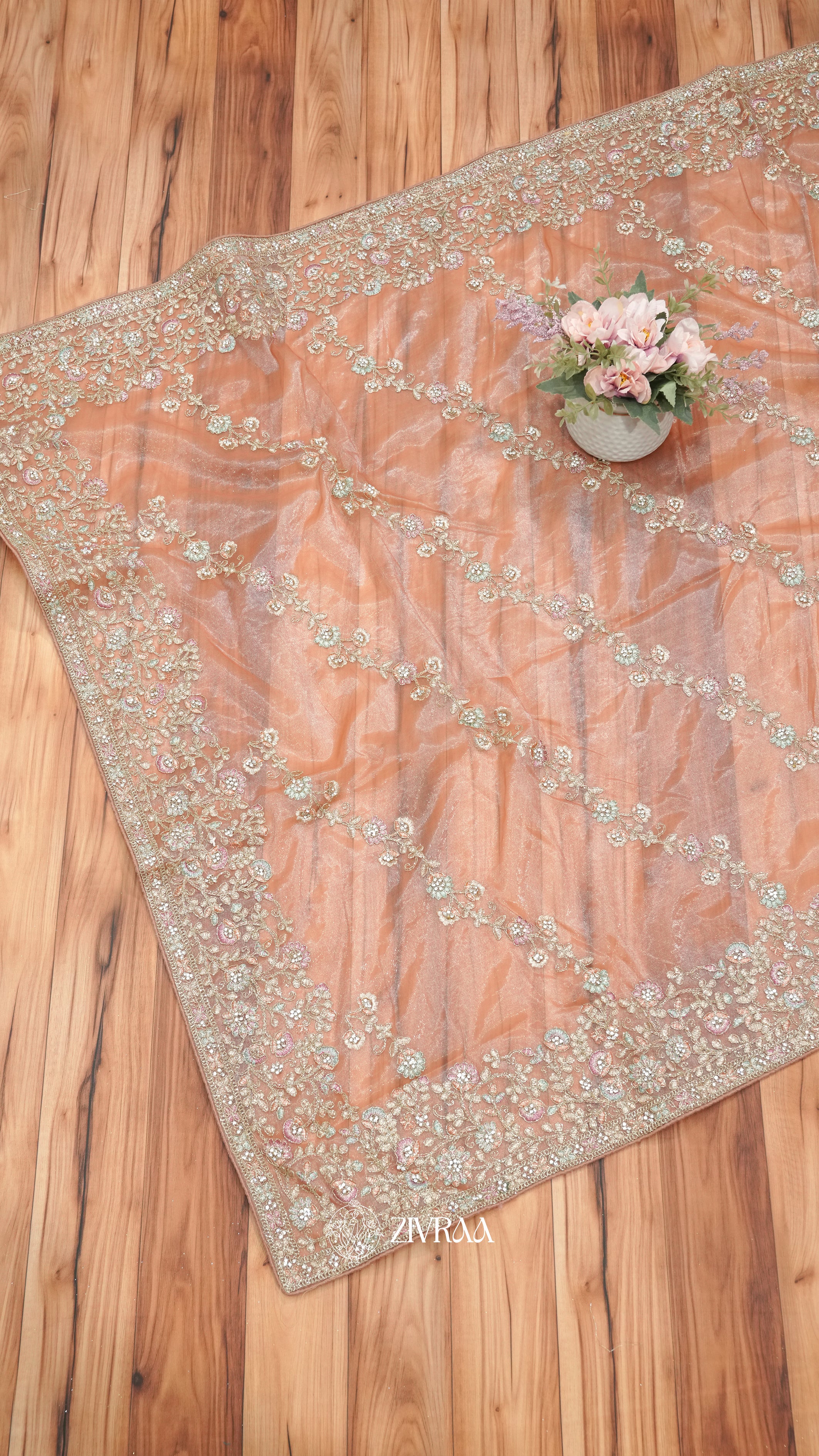 Peach shimmer net Saree with Heavy Floral Embroidery & Designer Border