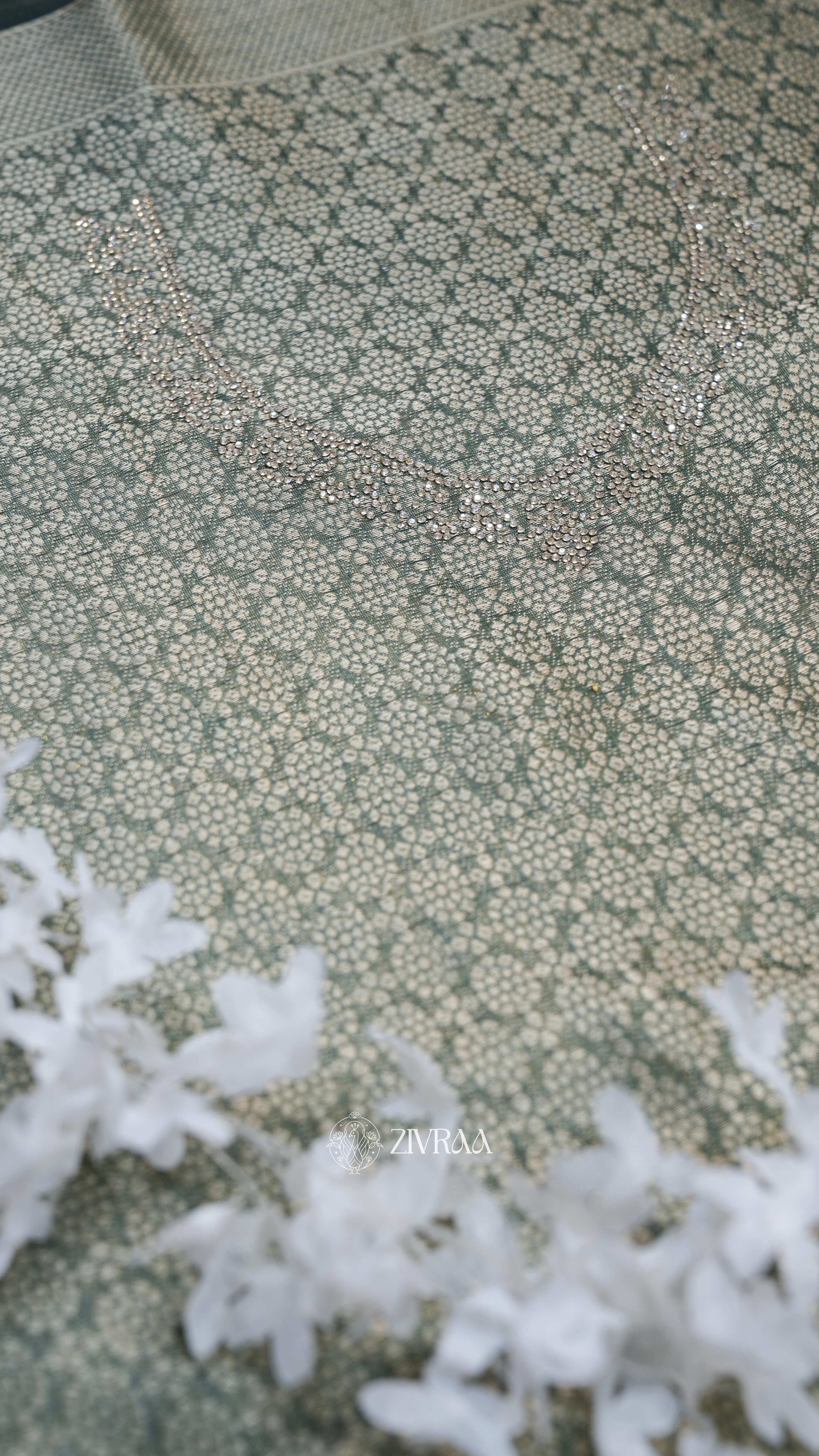 Olive Green Silk Blend Saree with Silver Zari & Handcrafted Motif Border